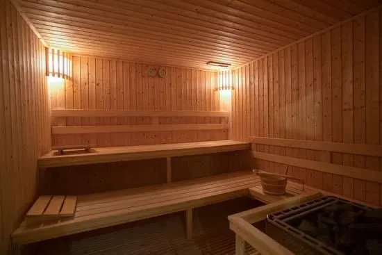 Modern indoor sauna with warm ambient lighting and minimalist design